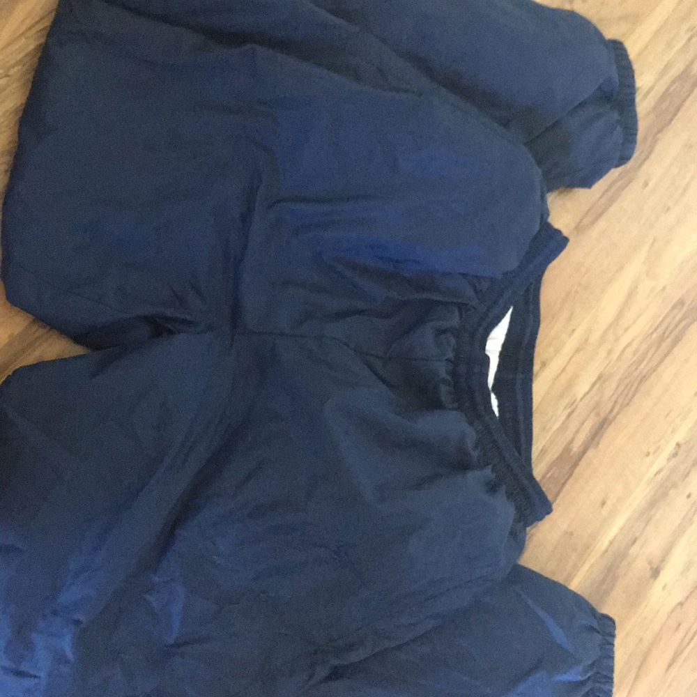 NIKE track pants.
